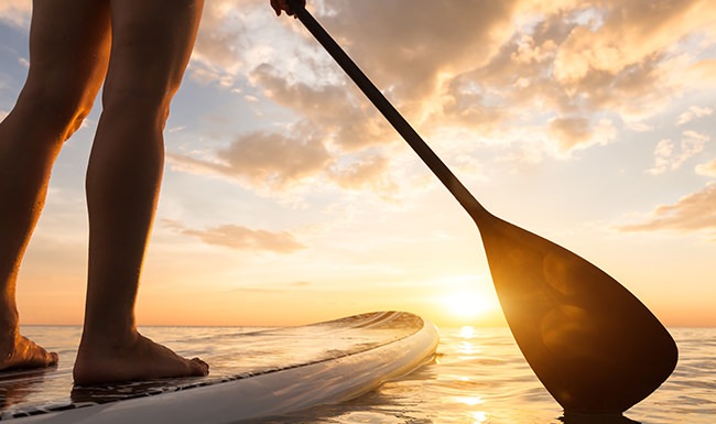 Person paddleboarding in the lake